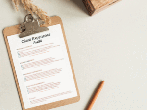 Client Experience Audit checklist displayed on a neutral-toned workspace with a clipboard, and pen, showing a professional layout for internal client onboarding evaluation.